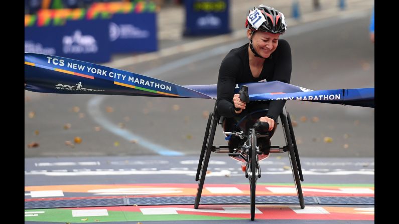 Swiss athlete Manuela Schar celebrates after she won the New York City Marathon's wheelchair division on Sunday, November 5.
