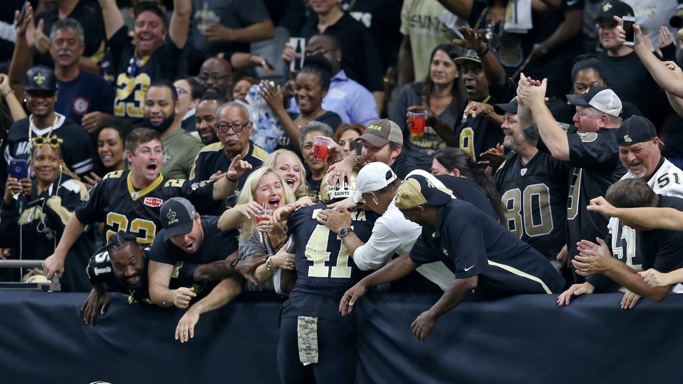 New Orleans running back Alvin Kamara celebrates a touchdown with fans during an NFL game against Tampa Bay on Sunday, November 5. Kamara scored two touchdowns in the Saints' 30-10 victory.