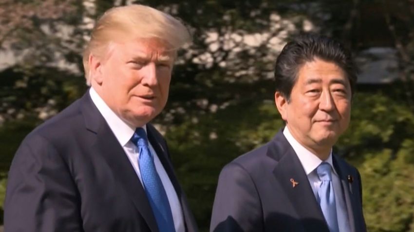 US President Donald J. Trump walks with Japan's Prime Minister Shinzo Abe on November 6, 2017