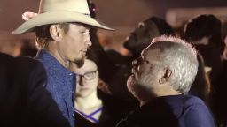 Stephen Willeford, right, hugs Johnnie Langendorff during a vigil for the victims of the First Baptist Church shooting Monday, Nov. 6, 2017, in Sutherland Springs, Texas. Willeford shot suspect Devin Patrick Kelley and Langendorff drove the truck while they chased Kelley. Kelley opened fire inside the church in the small South Texas community on Sunday, killing more than two dozen and injuring others. (AP Photo/David J. Phillip