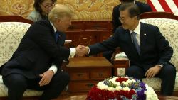 trump moon south korea handshake