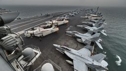 A general view shows the flight deck on board the aircraft carrier USS Theodore Roosevelt (CVN 71) as the vessel sails towards the Straits of Malacca heading to Singapore on October 23, 2015. The aircraft carrier USS Theodore Roosevelt is on its way to Singapore for a stop over for a routine port visit before heading to San Diego. AFP PHOTO / ROSLAN RAHMAN        (Photo credit should read ROSLAN RAHMAN/AFP/Getty Images)