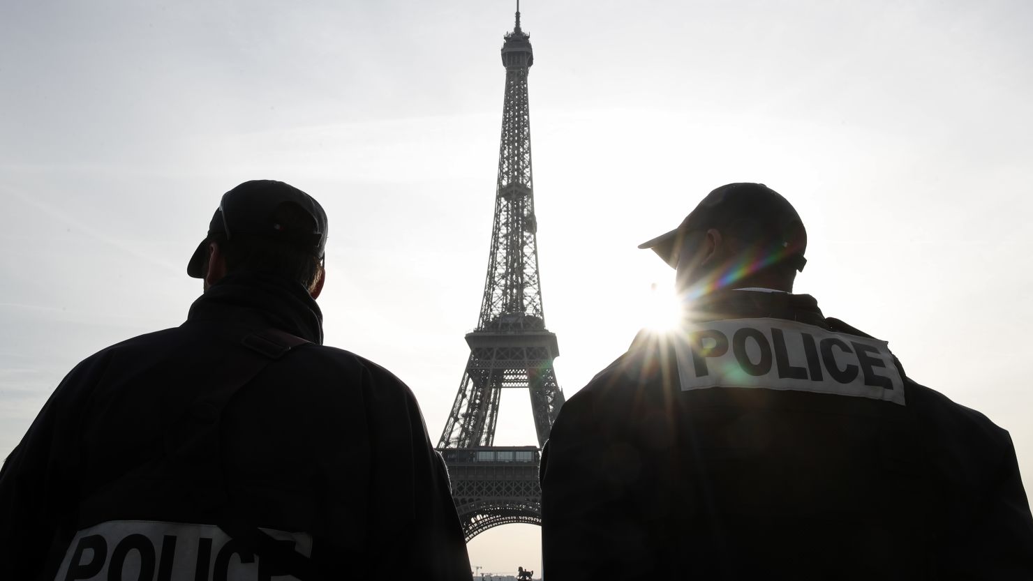 Police patrol in front of the Eiffel Tower in Paris last week as France officially ended a state of emergency.