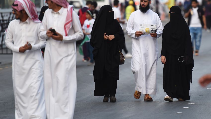People walk on Tahlia street in the Saudi capital Riyadh on September 24, 2017, during celebrations for the anniversary of the founding of the kingdom. / AFP PHOTO / Fayez Nureldine        (Photo credit should read FAYEZ NURELDINE/AFP/Getty Images)