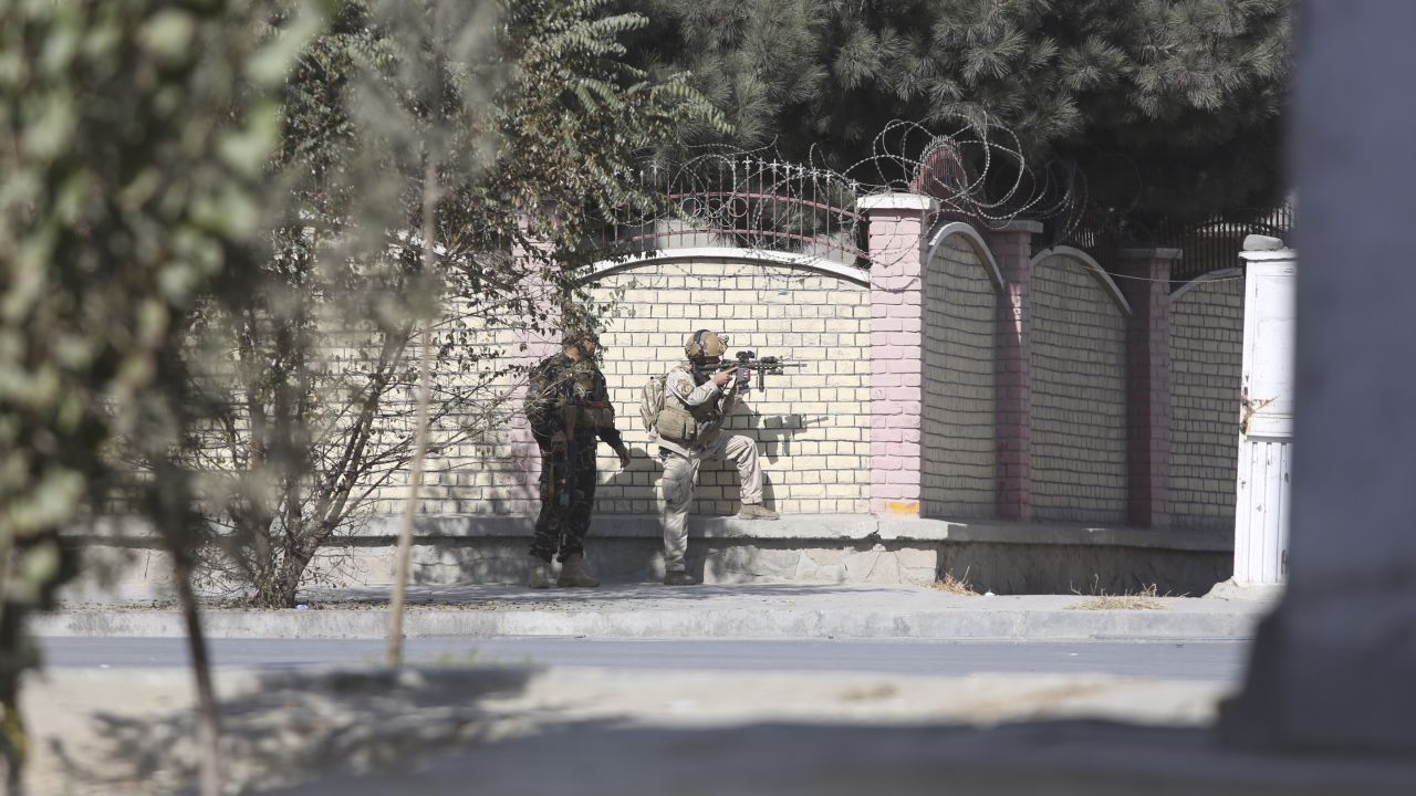 Afghan security personnel take a position near the Shamshad Television after an attack in Kabul, Afghanistan, Tuesday, Nov. 7, 2017.