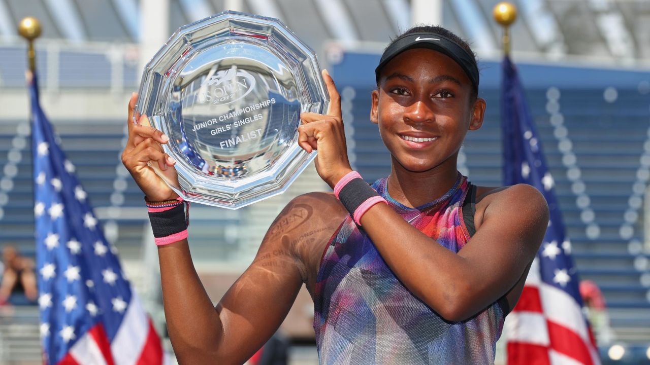 Gauff poses with the US Open's junior girls' runners-up trophy 