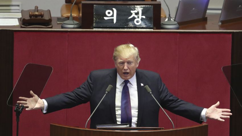 U.S. President Donald Trump delivers a speech as South Korea's National Assembly Speaker Chung Sye-kyun, top, listens at the National Assembly in Seoul, South Korea, Wednesday, Nov. 8, 2017. President Trump told South Korea's National Assembly that he wants "peace through strength."  The U.S. president addressed South Korean lawmakers on the second day of his visit. He noted that the U.S. is rebuilding its military and spending heavily on the newest and finest military equipment.(AP Photo/Lee Jin-man, Pool)
