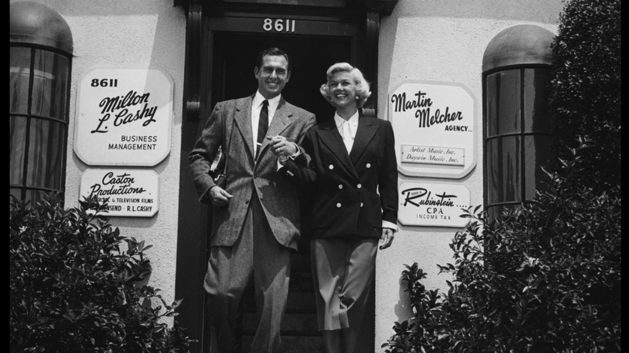 Day, with husband and manager Marty Melcher, outside his talent agency in Hollywood, circa 1960. 
