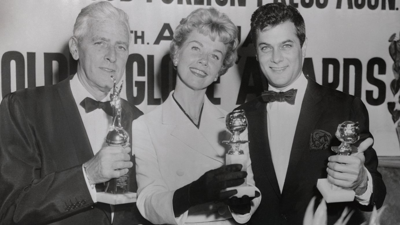 From left, Buddy Adler, Day and Tony Curtis pose after the 1958 Golden Globes.