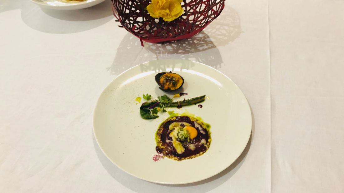 <strong>Food art:</strong> The vegetarian dish that helped him win symbolizes the cultural mix of Italy's south, featuring a patchwork of bright spices, pumpkins, oranges and mayonnaise. 
