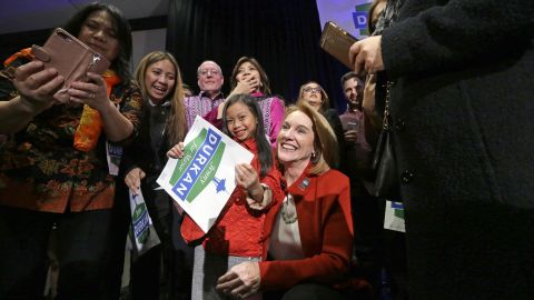 Seattle mayoral candidate Jenny Durkan poses for photos with supporters at an election night party Tuesday, Nov. 7, 2017, in Seattle. 