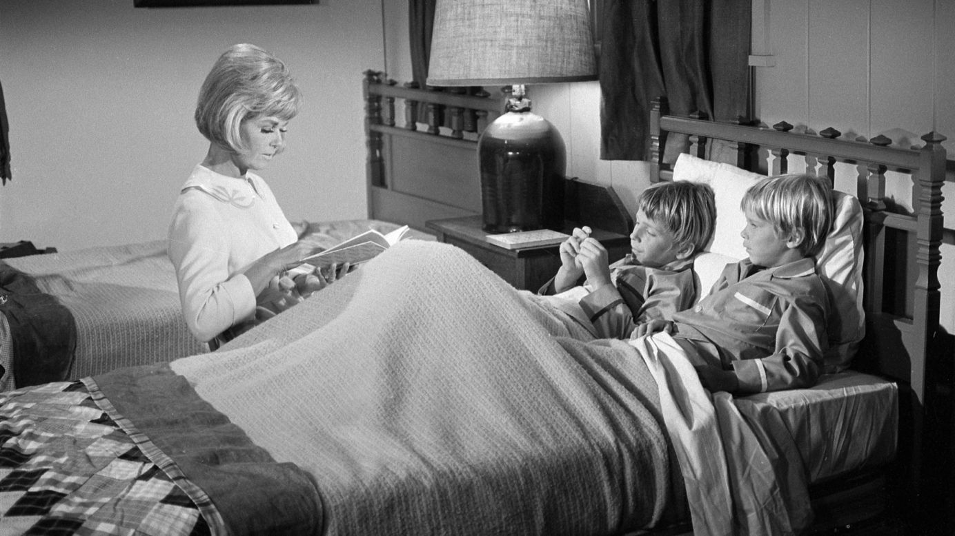 Day reads a bedtime story during a scene from "The Doris Day Show" in 1969. Day starred in the TV sitcom from 1968-1973.