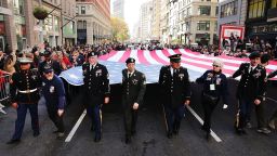 Caption: NEW YORK, NY - NOVEMBER 11: Veterans and others carry a large American Flag while marching in the nation's largest Veterans Day Parade in New York City on November 11, 2016 in New York City. Known as 'America's Parade' it features over 20,000 participants, including veterans of numerous eras, military units, businesses and high school bands and civic and youth groups.
