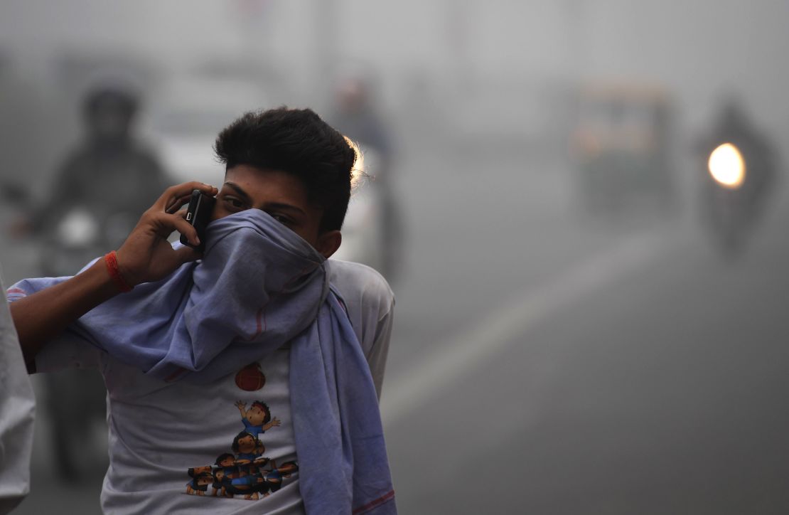 A Delhi commuter talks on a phone amid heavy smog November 8, 2017.
