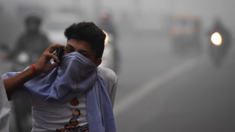 A Delhi commuter talks on a phone amid heavy smog November 8, 2017.
