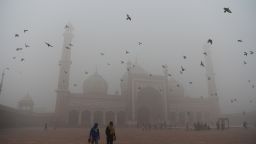 Indian visitors walk through the courtyard of Jama Masjid amid heavy smog in the old quarters of New Delhi on November 8, 2017.
Delhi shut all primary schools on November 8 as pollution levels hit nearly 30 times the World Health Organization safe level, prompting doctors in the Indian capital to warn of a public health emergency. Dense grey smog shrouded the roads of the world's most polluted capital, where many pedestrians and bikers wore masks or covered their mouths with handkerchiefs and scarves.
 / AFP PHOTO / Sajjad HUSSAIN        (Photo credit should read SAJJAD HUSSAIN/AFP/Getty Images)