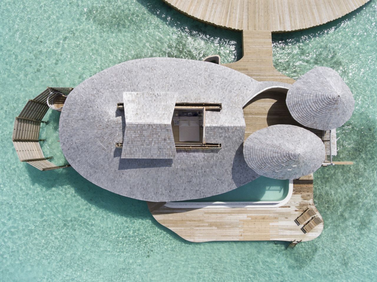 <strong>Built for stargazing:</strong> Each villa's master bedroom has its own retractable roof that slides back for stargazing.
