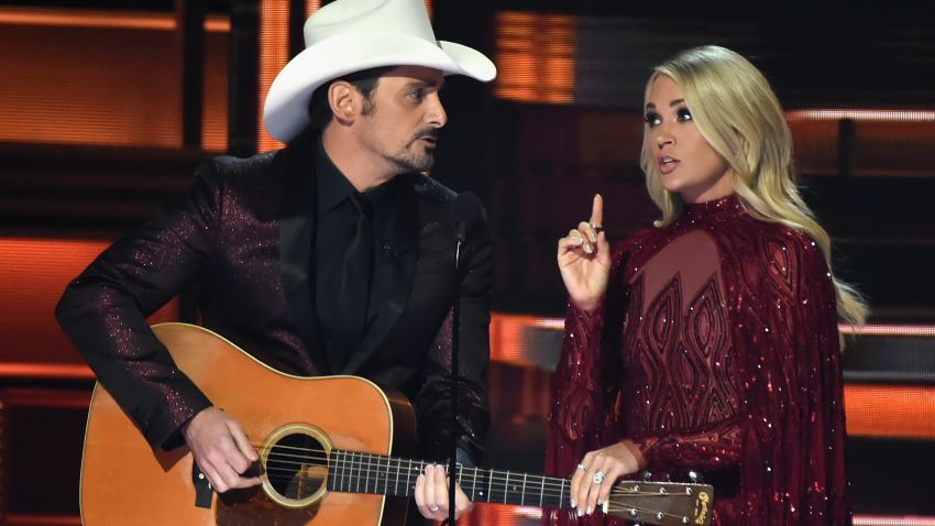 NASHVILLE, TN - NOVEMBER 08:  Co-hosts Brad Paisley and Carrie Underwood speak onstage at the 51st annual CMA Awards at the Bridgestone Arena on November 8, 2017 in Nashville, Tennessee.  (Photo by Rick Diamond/Getty Images)