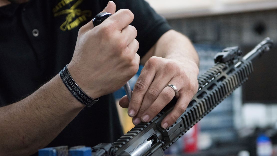 Karl Sorken, production manager for Battle Rifle Co. of Webster, Texas, works on the rails of an AR-15 style rifle.