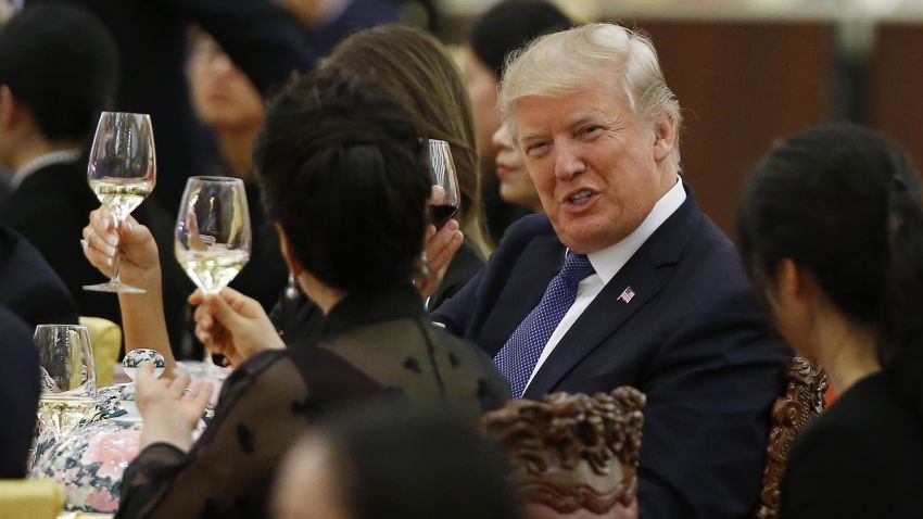 US President Donald Trump makes a toast to Peng Liyuan (back facing camera), wife of China's President Xi Jinping, during a state dinner in the Great Hall of the People in Beijing on November 9, 2017.Donald Trump urged Chinese leader Xi Jinping to work hard and act fast to help resolve the North Korean nuclear crisis during talks in Beijing Thursday, warning that "time is quickly running out". / AFP PHOTO / POOL / THOMAS PETER        (Photo credit should read THOMAS PETER/AFP/Getty Images)