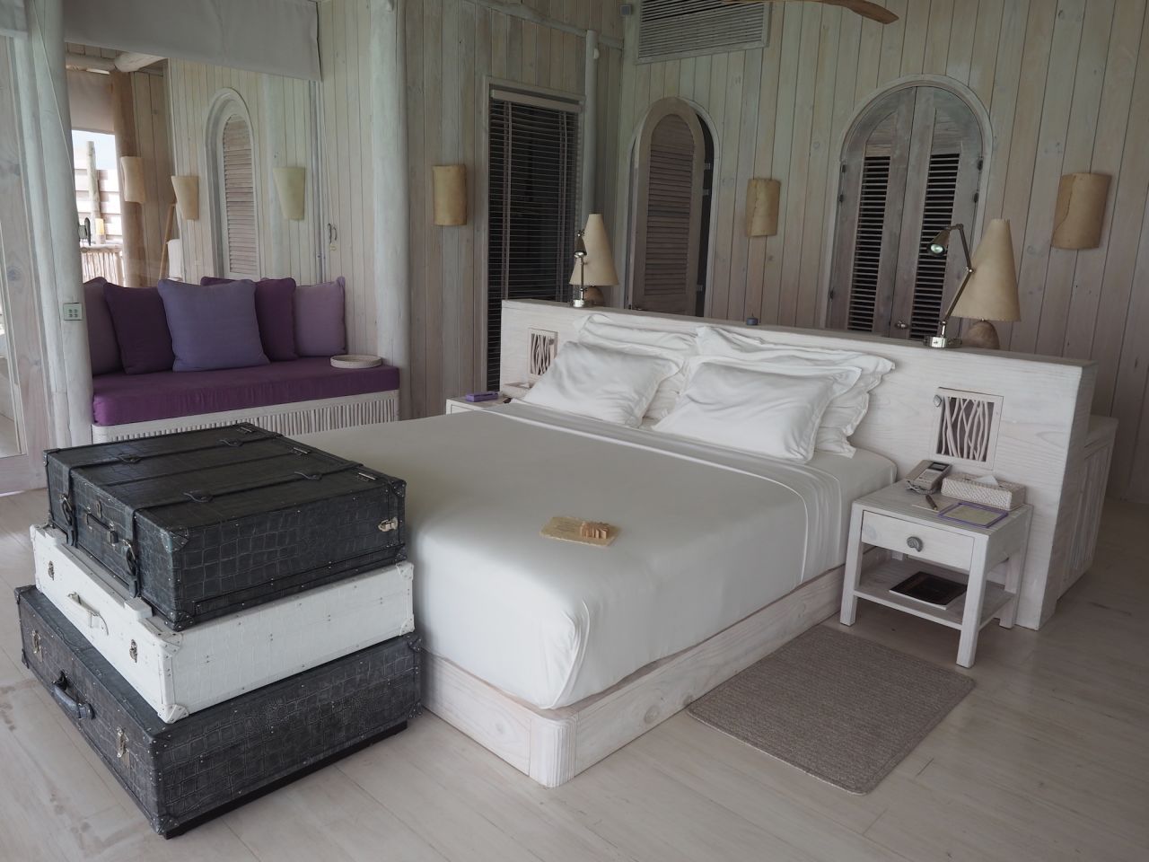 <strong>One-bedroom villa: </strong>The master bedroom in the one-bedroom villa. Highlighting the resort's "no news, no shoes" philosophy, the TV is hidden inside those mock chests at the end of the bed. 