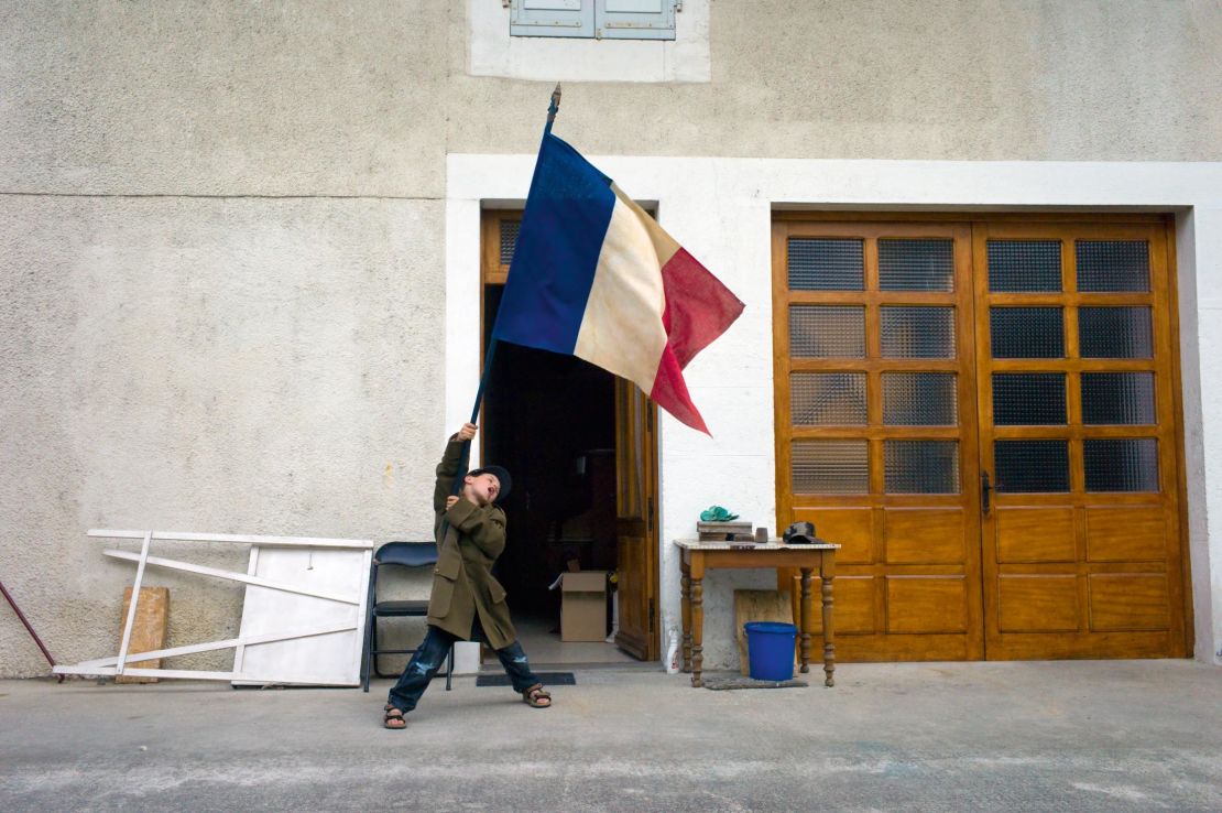 British photographer Nick Turpin founded the renowned street photography collective, In-Public. Dividing his time between the UK and France, Turpin captured this image in Artemare, near Lyon.