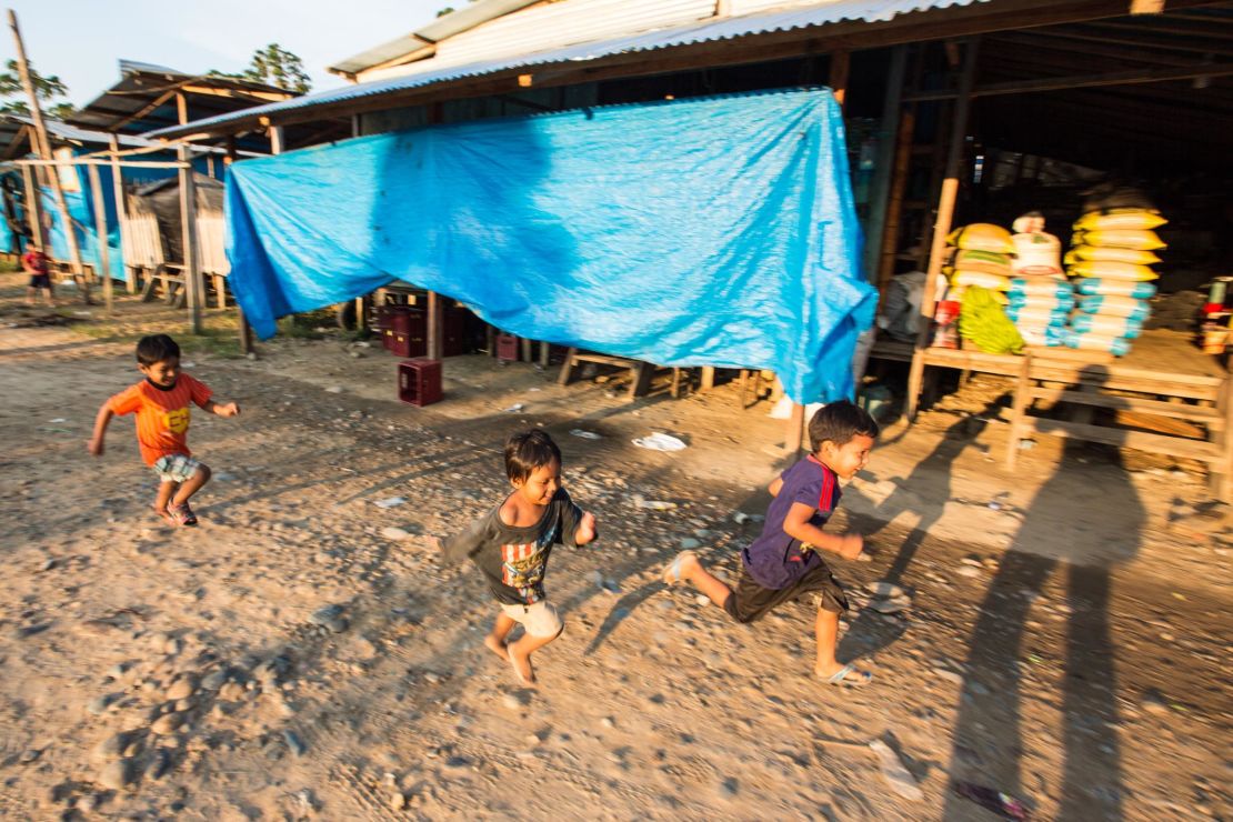 Kids play near a camp of illegal gold miners in the Madre de Dios region of Peru.