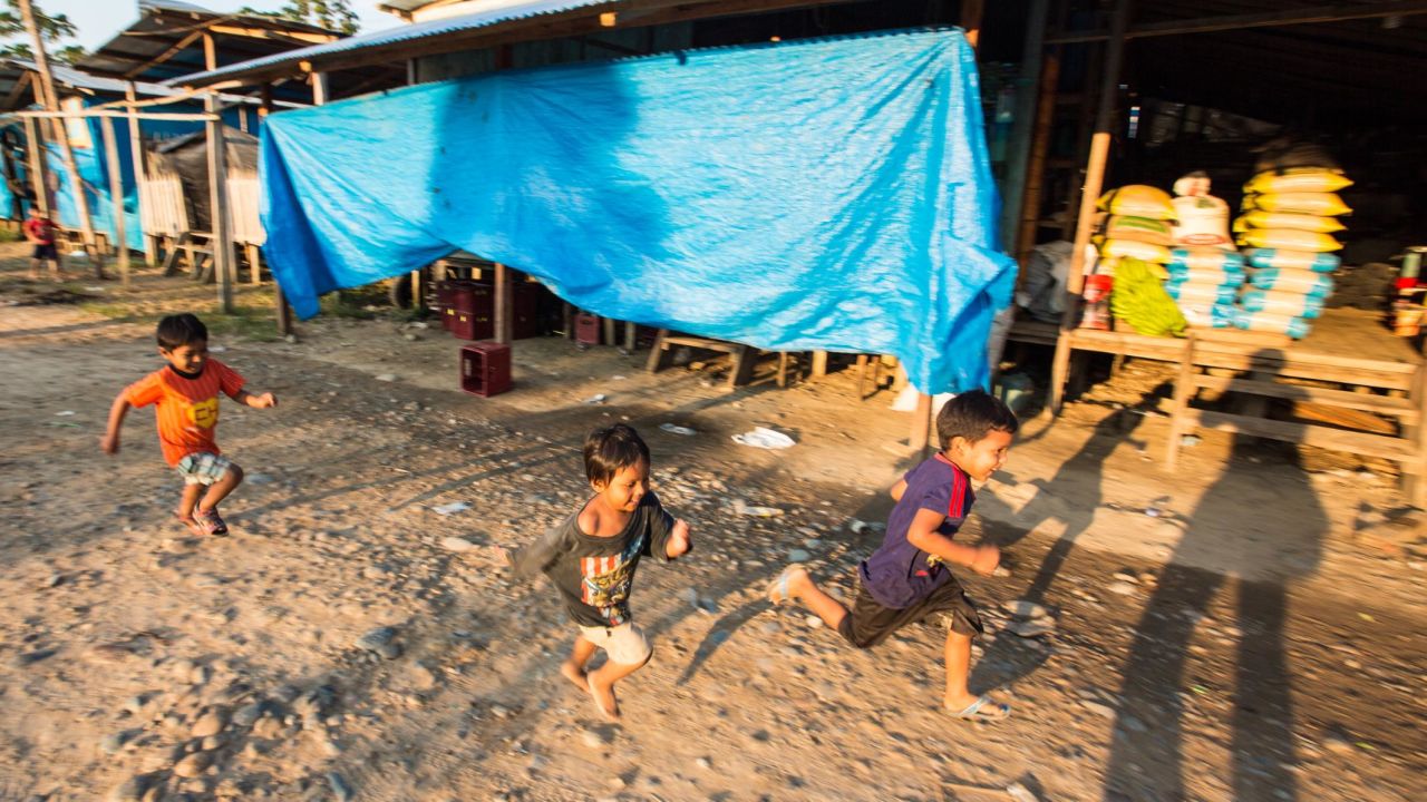 Kids play near a camp of illegal gold miners in the Madre de Dios region of Peru.