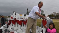 Carpenter Greg Zanis (C) who drove from Chicago unloads his crosses outside the First Baptist Church which was the scene of the mass shooting that killed 26 people in Sutherland Springs, Texas on November 8, 2017.
A gunman wearing all black armed with an assault rifle opened fire on a small-town Texas church during Sunday morning services, on November 5, killing 26 people and wounding 20 more in the last mass shooting to shock the United States. / AFP PHOTO / MARK RALSTON        (Photo credit should read MARK RALSTON/AFP/Getty Images)
