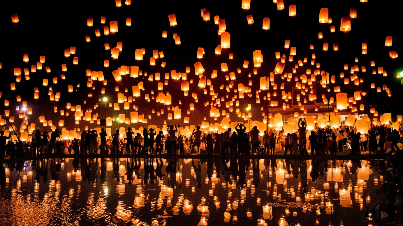 A crowd releases lanterns in the air to celebrate the Yee Peng festival, also known as the festival of lights, in Chiang Mai, Thailand, on Friday, November 3.