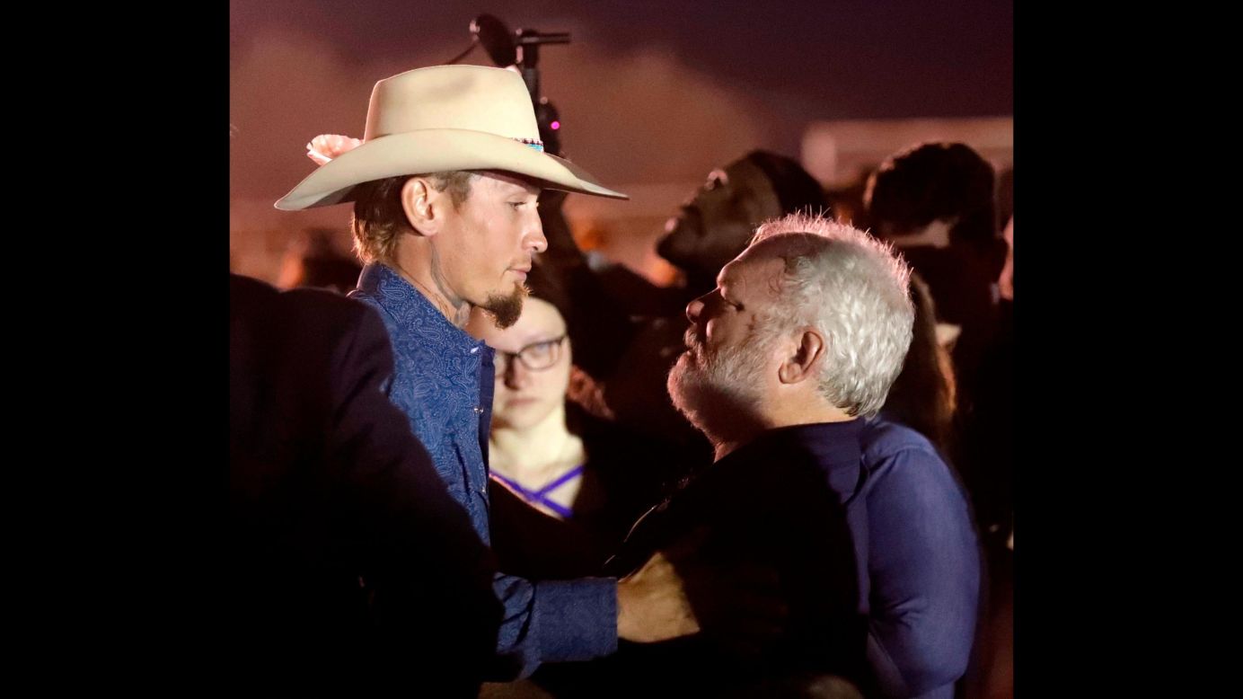 Stephen Willeford, right, embraces Johnnie Langendorff at a vigil held Monday, November 6, for the victims of a <a href="http://www.cnn.com/2017/11/05/us/gallery/sutherland-springs-church-shooting/index.html" target="_blank">church shooting</a> in Sutherland Springs, Texas. The two men <a href="http://www.cnn.com/2017/11/07/us/church-shooting-heroes-reunite-trnd/index.html" target="_blank">pursued gunman Devin Patrick Kelley</a> in Langendorff's truck after Kelley opened fire in the church, killing at least 26 people. Willeford exchanged gunfire with Kelley, who eventually crashed into a ditch.