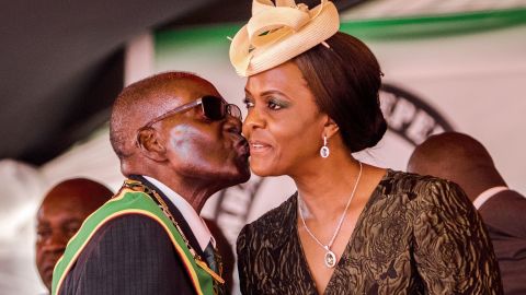 President Robert Mugabe kisses his wife and first lady Grace Mugabe during during the country's 37th Independence Day celebrations at the National Sports Stadium in Harare April 18, 2017. 