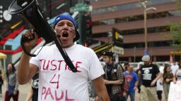 DENVER, CO - July 14: Thomas Morado, cousin of Paul Castaway, leads the march during a protest about the police involved shooting of Paul Castaway on Tuesday, July 14, 2015 along the 16th Street Mall in Denver, Colorado. Paul Castaway, 35, was shot four times and killed by police Sunday evening while holding a knife. According to police reports Castaway came "dangerously close" to officers with the knife while family members recount the events seen from a video tape that Castaway had the knife to his throat the whole time.   (Photo By Brent Lewis/The Denver Post via Getty Images)