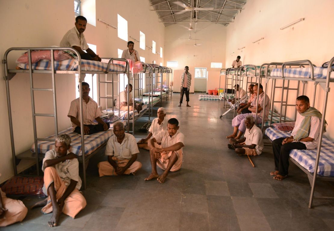 Beggars sit inside a dormitory in Hyderabad on November 8.