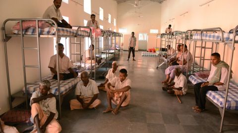 Beggars sit inside a dormitory in Hyderabad on November 8.