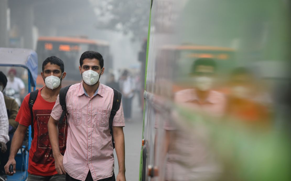 Many Delhi commuters have taken to wearing protective masks.
