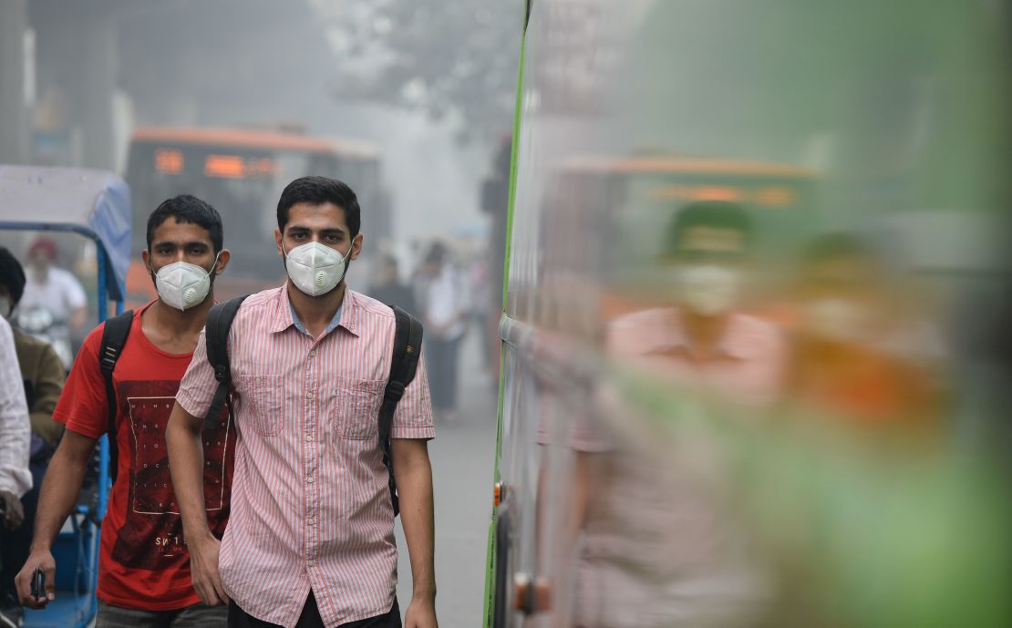 Many Delhi commuters have taken to wearing protective masks.