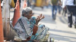 An Indian woman begs on the side of the road in Hyderabad on November 10, 2017.
A city in southern India has banned begging in public places ahead of a three-day summit that Ivanka Trump is due to attend, police said November 10.
 / AFP PHOTO / NOAH SEELAM        (Photo credit should read NOAH SEELAM/AFP/Getty Images)