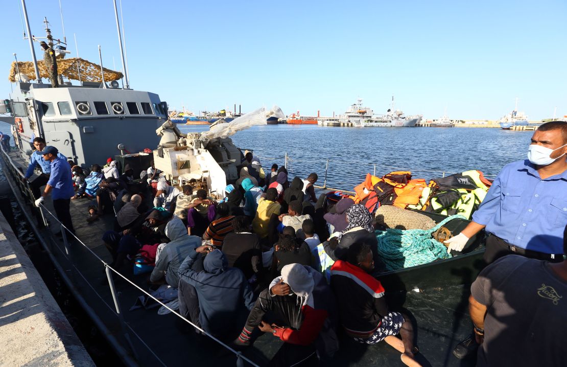 Migrants rescued from the Mediterranean arrive at a naval base in Tripoli in October.