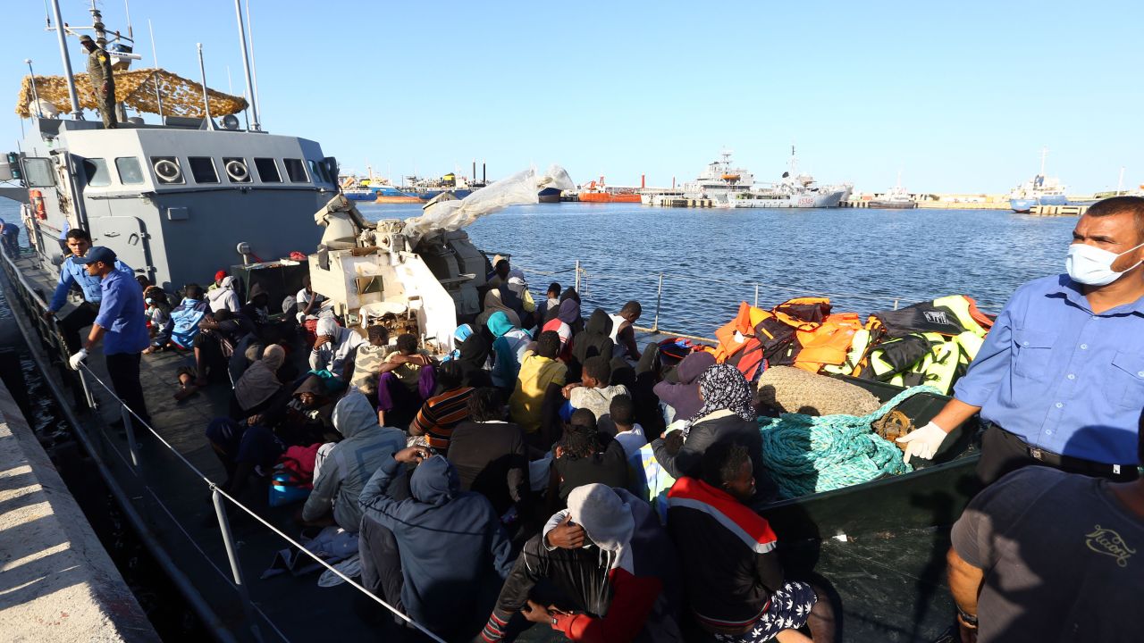 Migrants rescued from the Mediterranean arrive at a naval base in Tripoli in October.