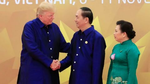 US President Donald Trump shakes hands with Vietnamese President Tran Dai Quang upon arrival for the Asia-Pacific Economic Cooperation (APEC) Summit