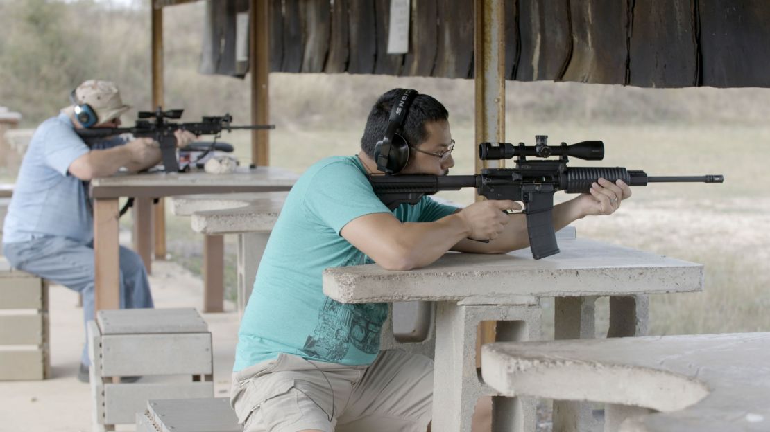 Joseph Sustayta, right, and father-in-law John Hirst check the accuracy of their rifles at a shooting range in Marion, Texas.