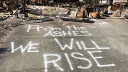 A message of resilience is spray painted on a street in the Coffey Park subdivision in Santa Rosa, California.
