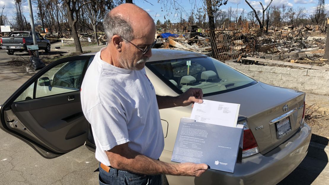Coffey Park resident John Wimmer displays the newly arrived check from his insurance company.