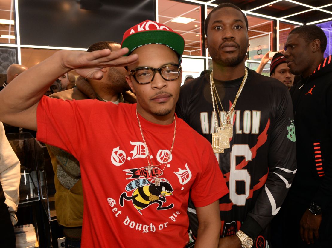 Meek Mill (right) with rapper T.I., who has urged people to compare Meek's sentencing to the lack of consequences most police officers face after episodes of police violence. 