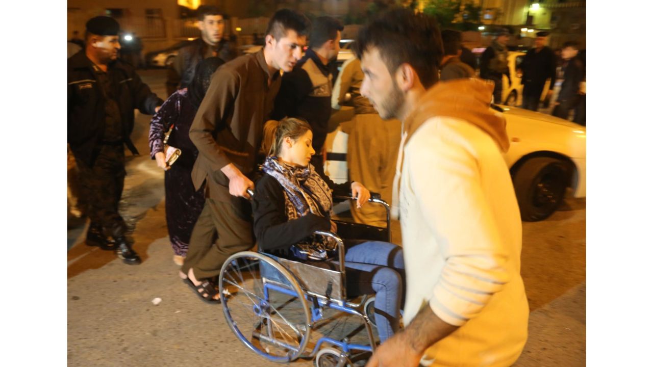 SULAYMANIYAH, IRAQ - NOVEMBER 12: A woman with a wheel chair is seen at Sulaymaniyah Hospital after a 7.2 magnitude earthquake hit northern Iraq in Sulaymaniyah, Iraq on November 12, 2017.  (Photo by Feriq Ferec/Anadolu Agency/Getty Images)
