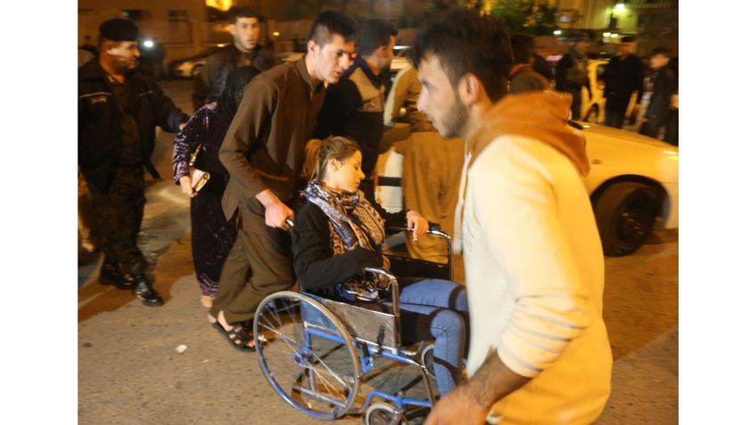 SULAYMANIYAH, IRAQ - NOVEMBER 12: A woman with a wheel chair is seen at Sulaymaniyah Hospital after a 7.2 magnitude earthquake hit northern Iraq in Sulaymaniyah, Iraq on November 12, 2017.  (Photo by Feriq Ferec/Anadolu Agency/Getty Images)