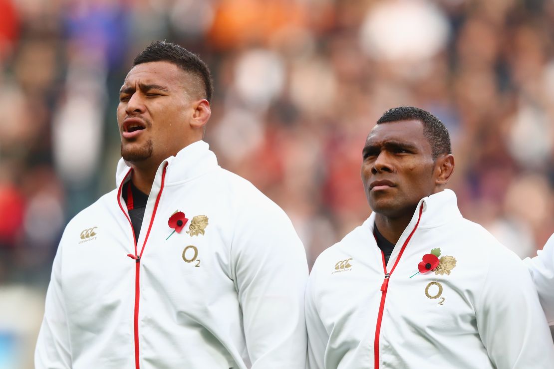 Semesa Rokoduguni (right) and Nathan Hughes stand for the national anthems 