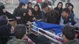 Iranians mourn over the body of a victim following a 7.3-magnitude earthquake in Sarpol-e Zahab in Iran's western province of Kermanshah on November 13, 2017.More than 200 people were killed and hundreds more injured when the 7.3-magnitude earthquake shook the mountainous Iran-Iraq border triggering landslides that hindered rescue efforts, officials said. / AFP PHOTO / TASNIM NEWS / Farzad MENATI        (Photo credit should read FARZAD MENATI/AFP/Getty Images)