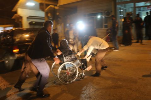 A wounded person is rushed to a hospital in Iraq's Sulaimaniya province on November 12.<br />